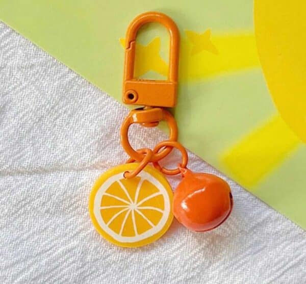 Orange dog jewelry with a bell